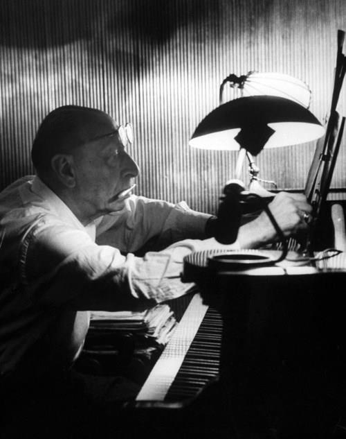 Igor Stravinsky working at a piano in an empty dance hall, 1957.