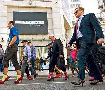 Toronto men walked  -a mile in her shoes-  to help end violence towards women. This picture says it all.