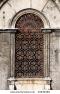 stock-photo-old-building-in-venice-italy-vintage-window-with-rusty-decorative-bars-61830388